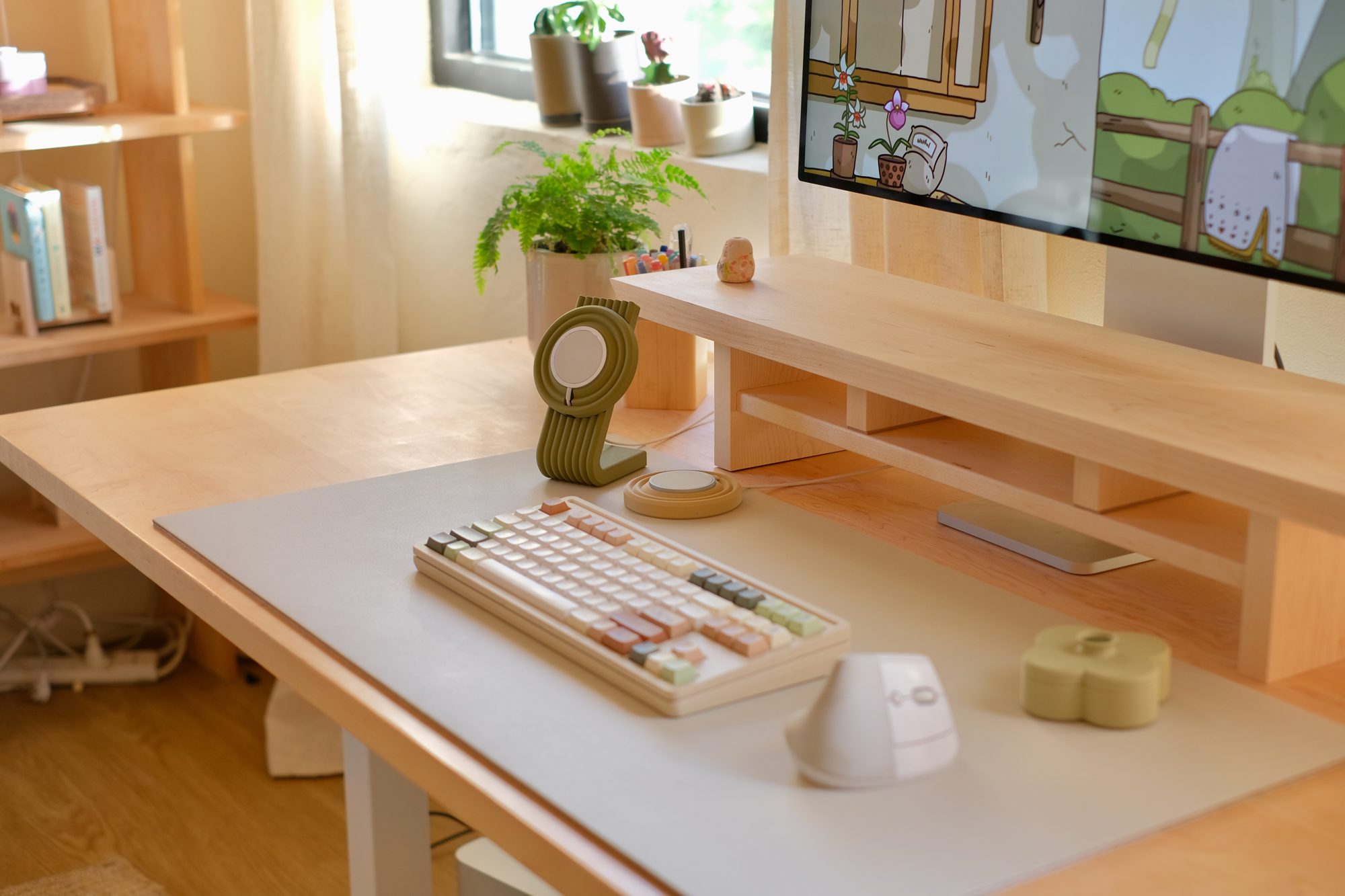 A Beige Cozyleigh Desk Mat with a Moss Zen MagSafe Charger Stand and a Pistachio Fa Trinket Tray