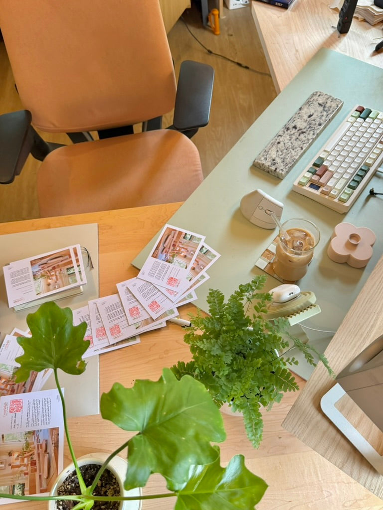 Printed July cards laid out on a table, seen from above