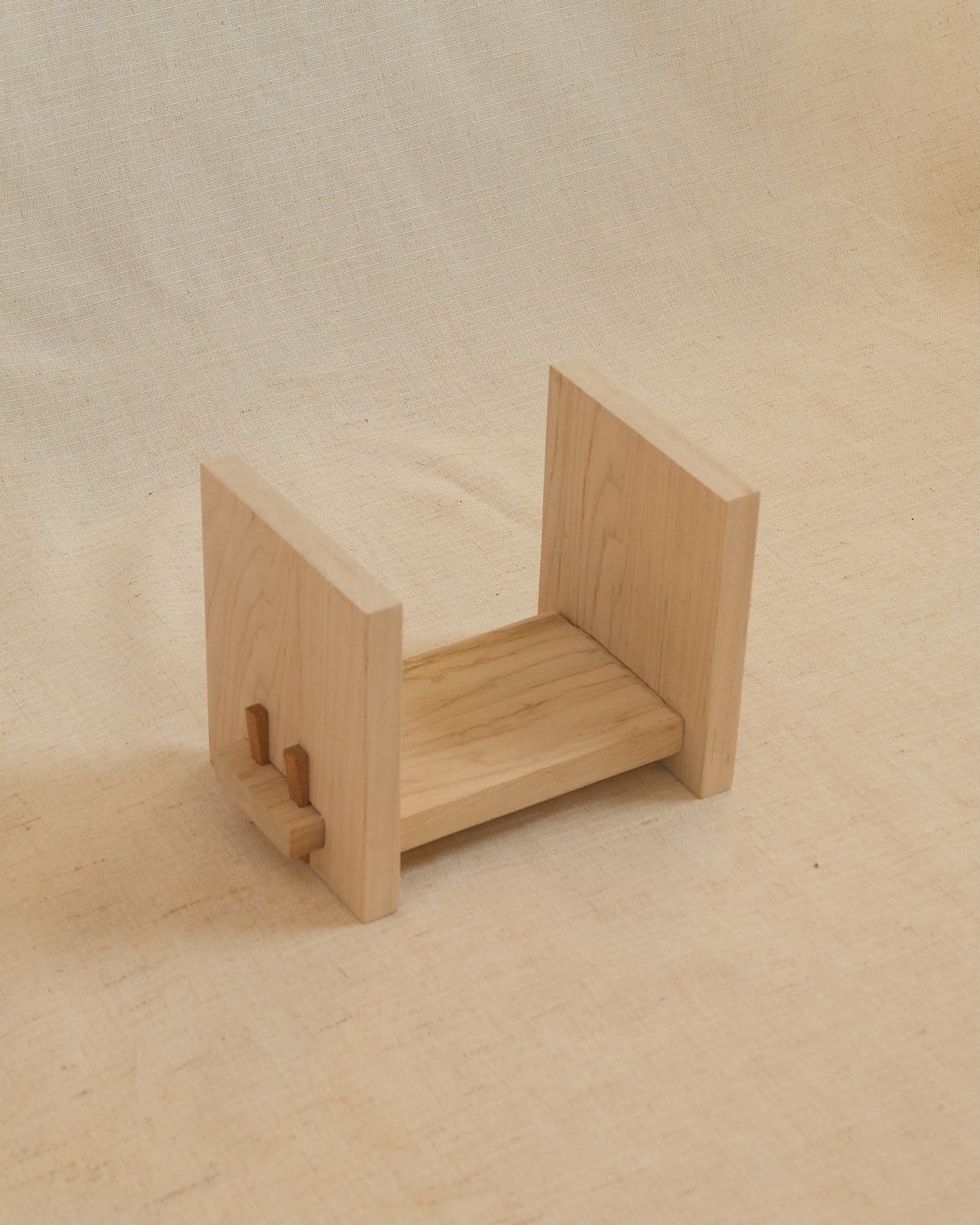An empty Zen Book Stand on linen