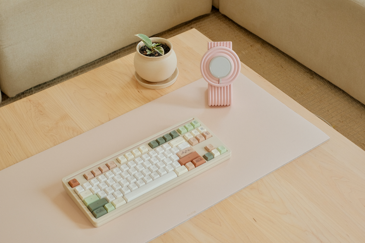 A Zen MagSafe Charger Stand paired with a desk mat