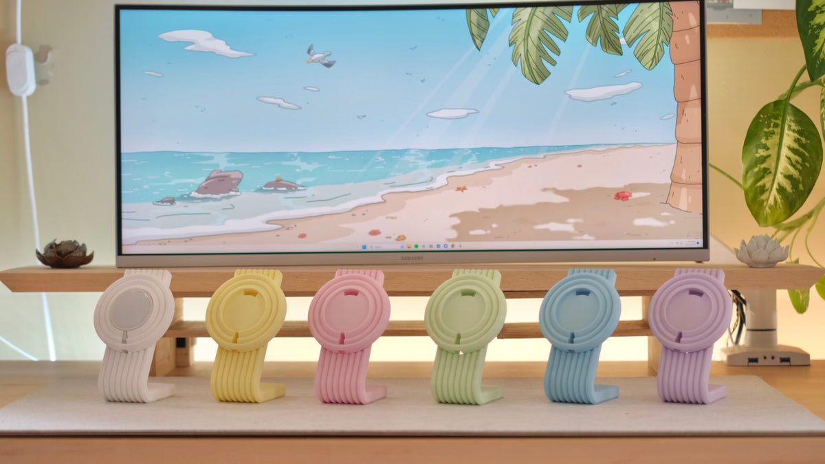 Zen MagSafe Charger Stands lined up in pastel colors on a desk