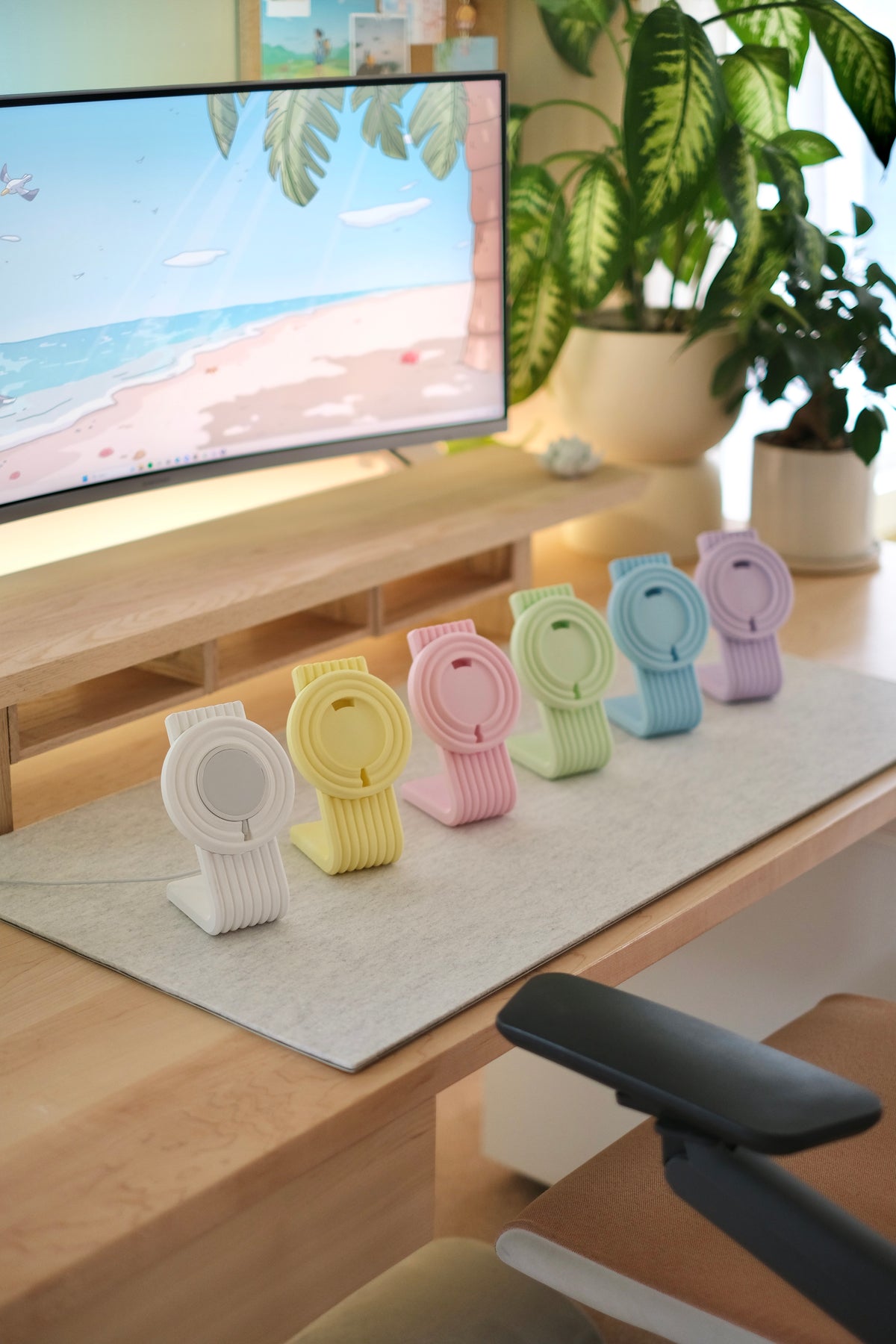 Zen MagSafe Charger Stands lined up in pastel colors on a desk