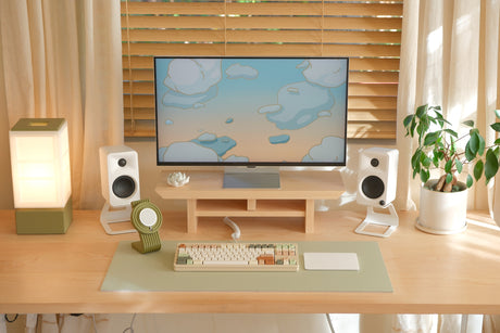Cozyleigh Desk Mat, Medium, in Matcha on the studio desk with the Zen MagSafe Charger Stand