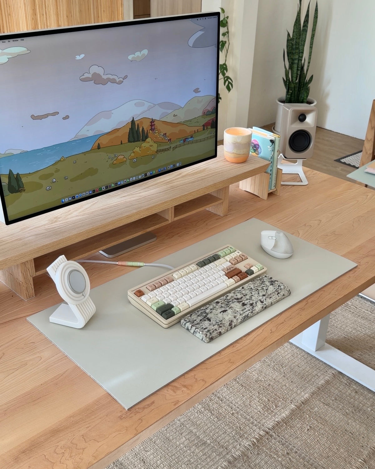 A desk setup shown on different desk mat colors