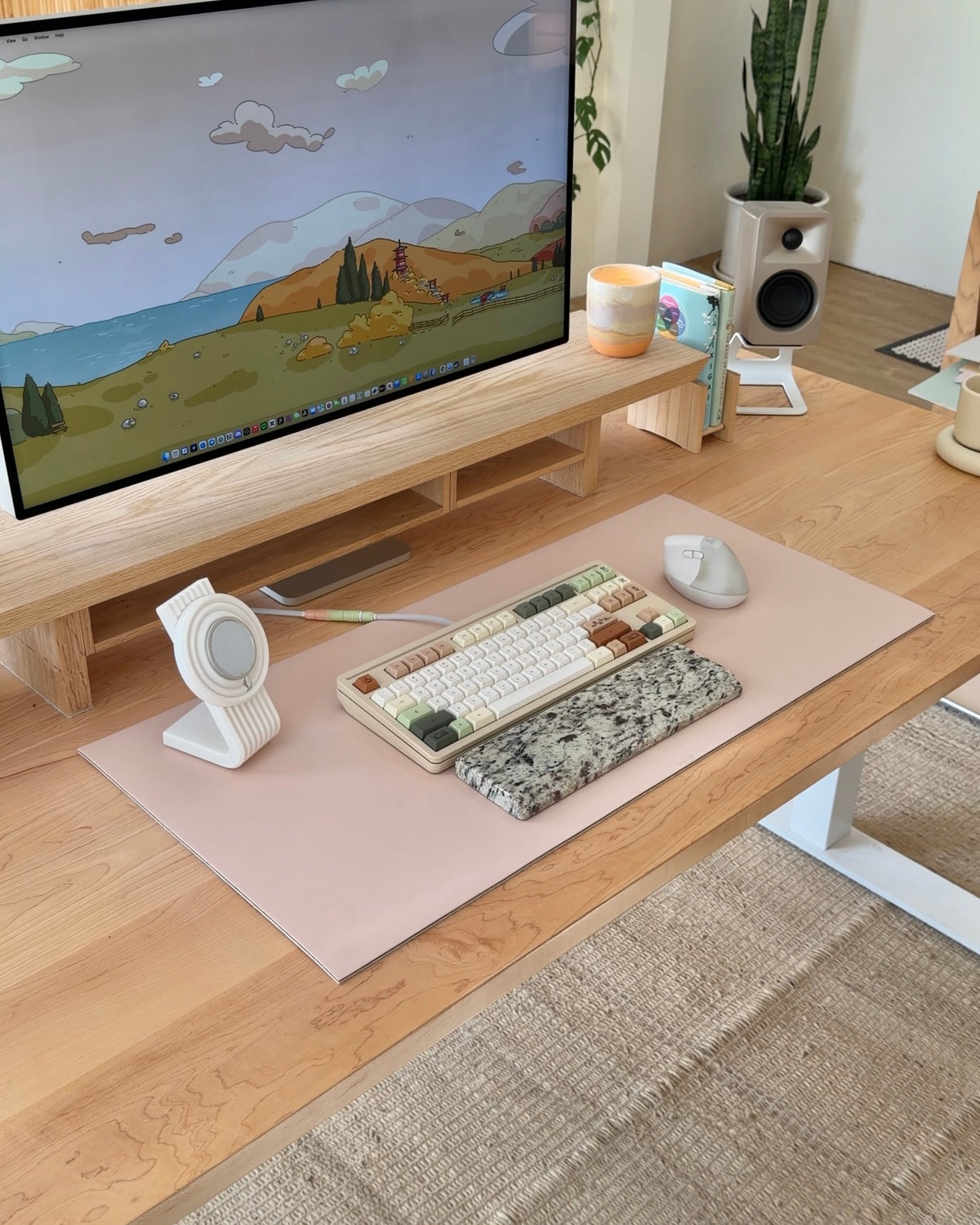 A desk setup shown on different desk mat colors