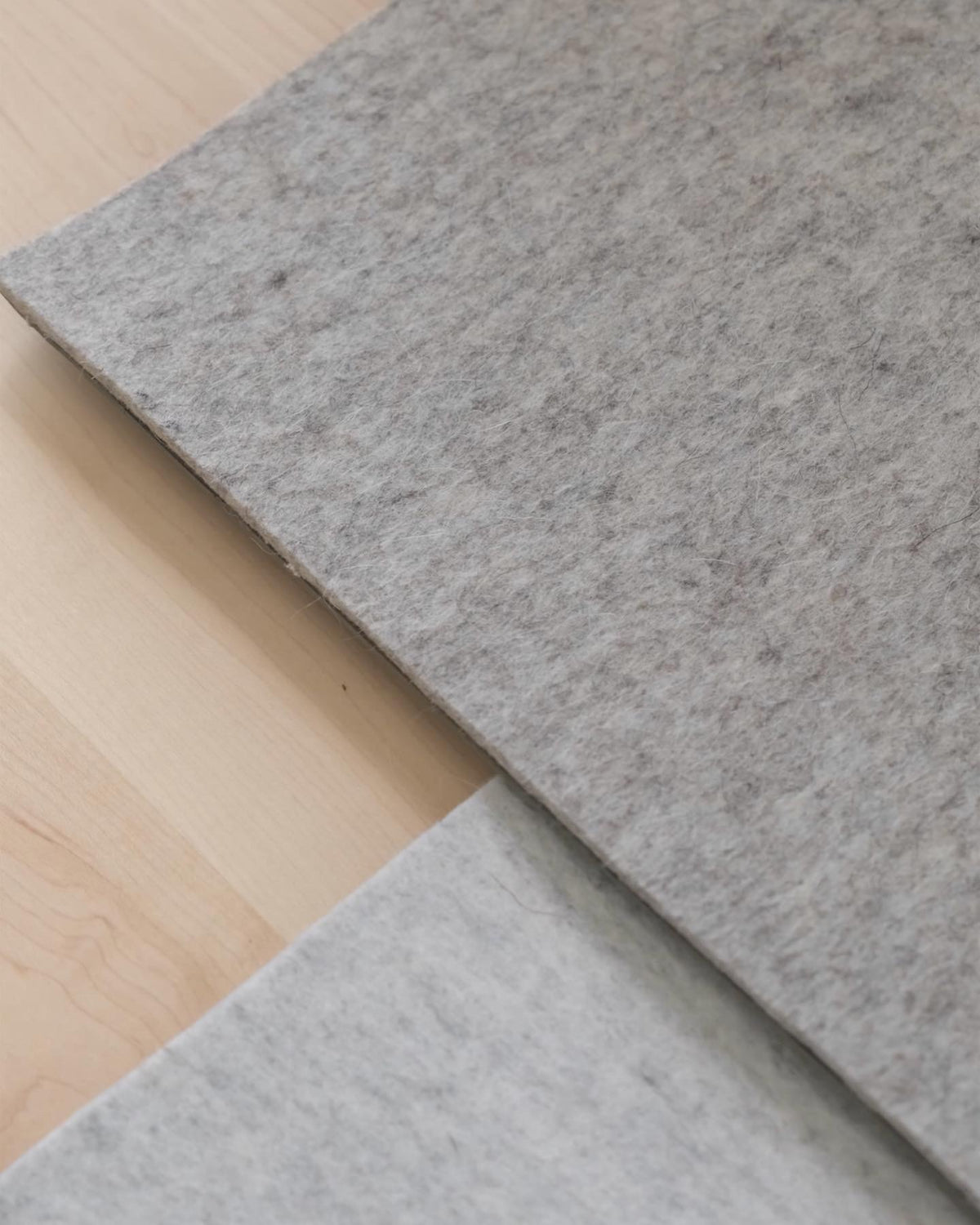Close-up of a wool felt desk mat edge