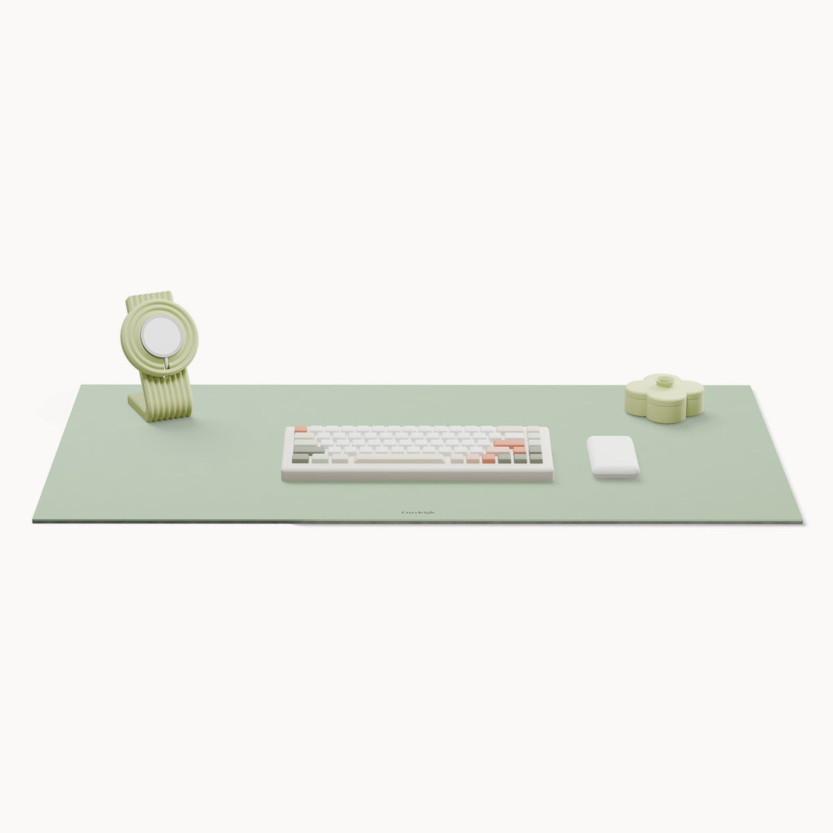 The cozy desk set: a Matcha desk mat with a Pistachio Zen charger stand at the back left and a Pistachio Fa tray at the back right, a keyboard and mouse in the middle for scale