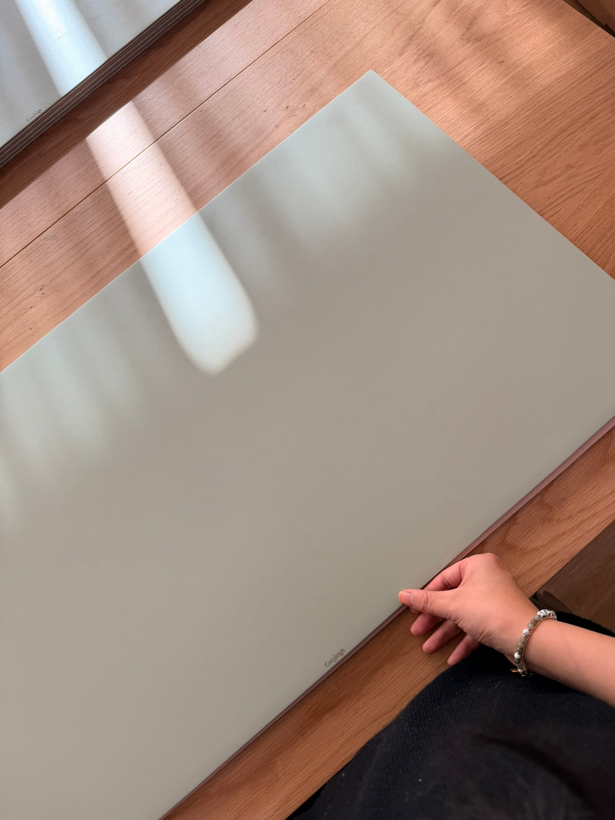 Smoothing the linoleum side, logo in the corner