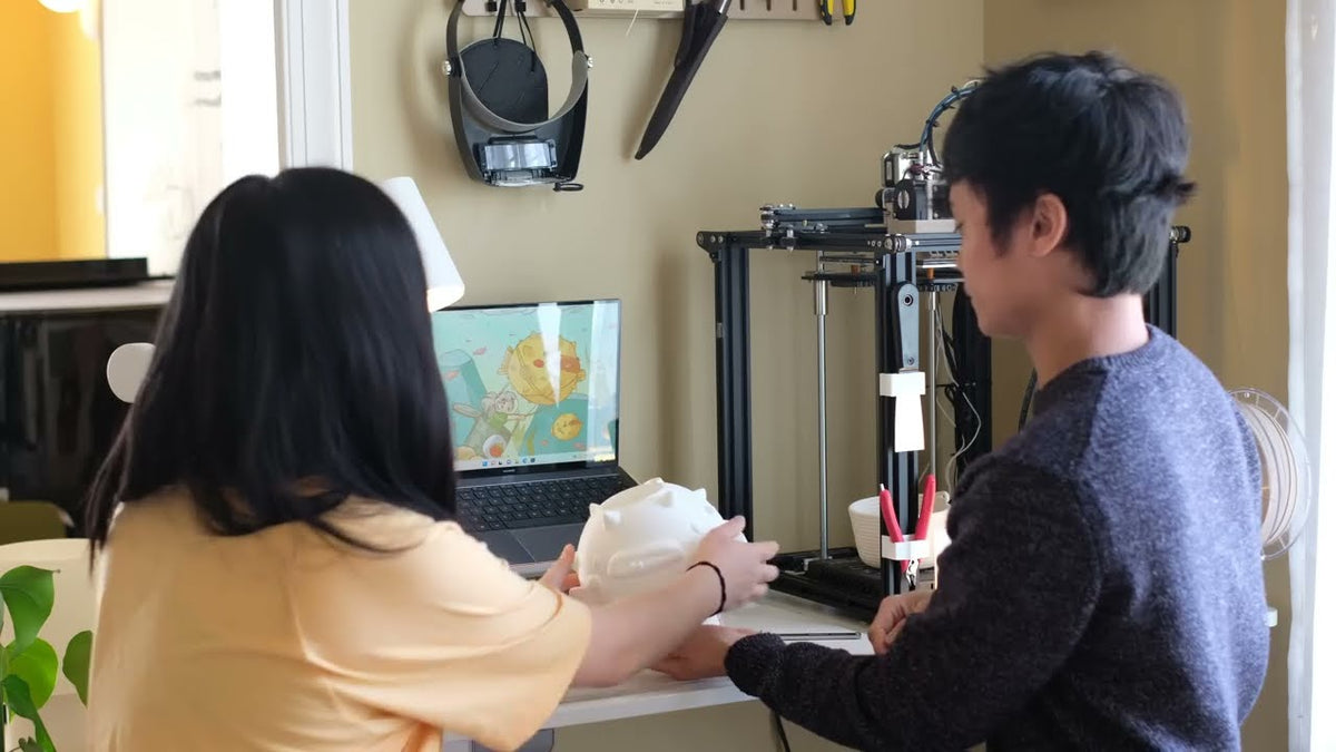 Ash and Tristan at work in our shared home office, 2022