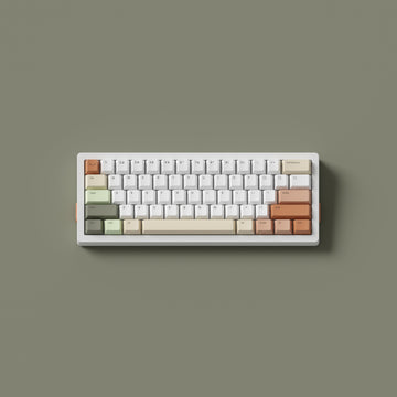A keyboard with Zen Keycaps in Cherry profile on a sage green background