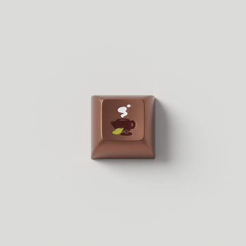 The Zen Metal Artisan keycap, Marshmallow profile, on a light background