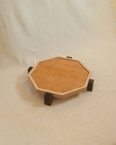 Zen Tray in Maple, Medium: octagonal maple frame with a cherry interior and walnut feet