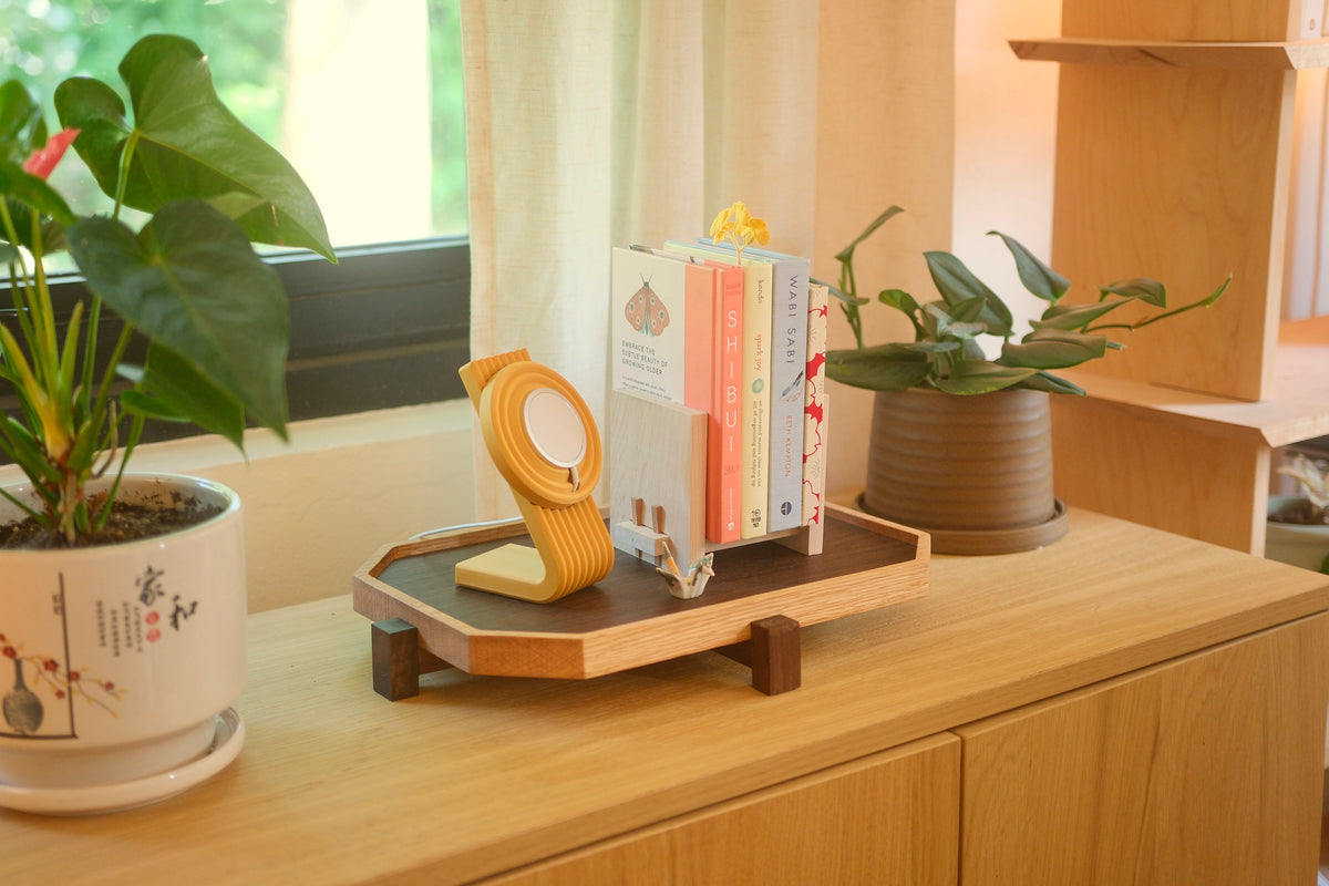 A Zen Tray with a charger stand on the sideboard